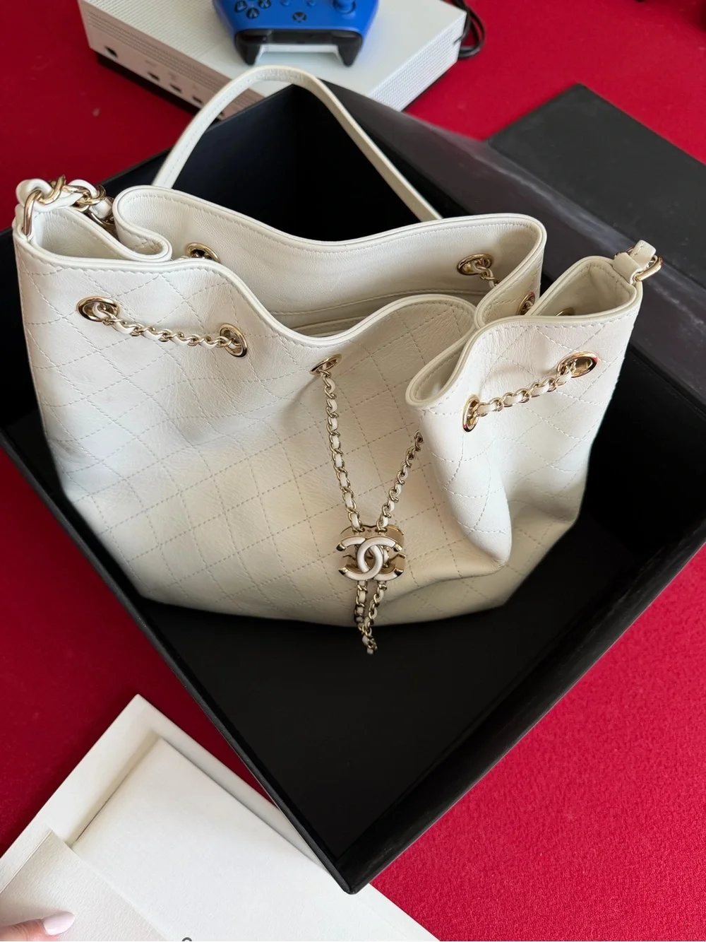 CHANEL Cream Quilted Drawstring Bucket Bag with Gold Chain